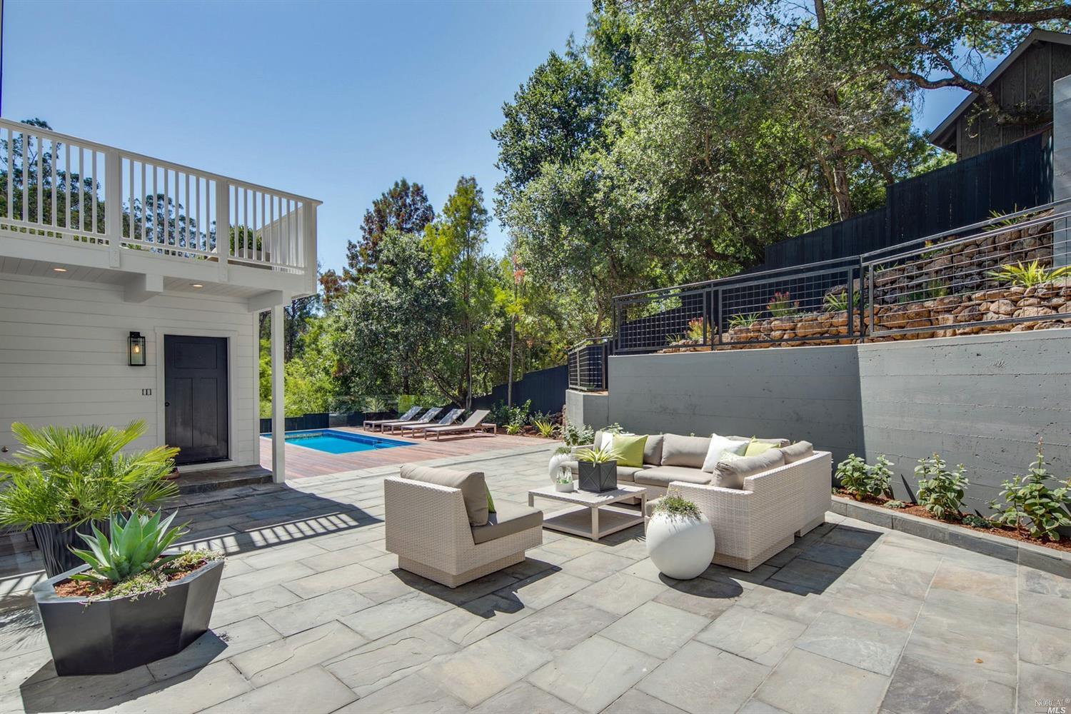 Stephen Charlip Landscape Architecture created this outdoor pool and patio area. The patio is located bewtween the main house and Pool House and ADU. Outdoor decks, landscape, gardens, garden and landscape design by Petaluma landscape designer and architect Stephen Charlip. We design unique wine country homes in Petaluma and throughout Sonoma county.