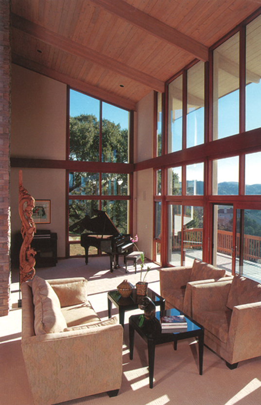Floor to ceiling glass capture views and natural light. The use of natural materials and high levels of insulation create a highly energy efficient home that stays warmer in winter and cooler in summer.